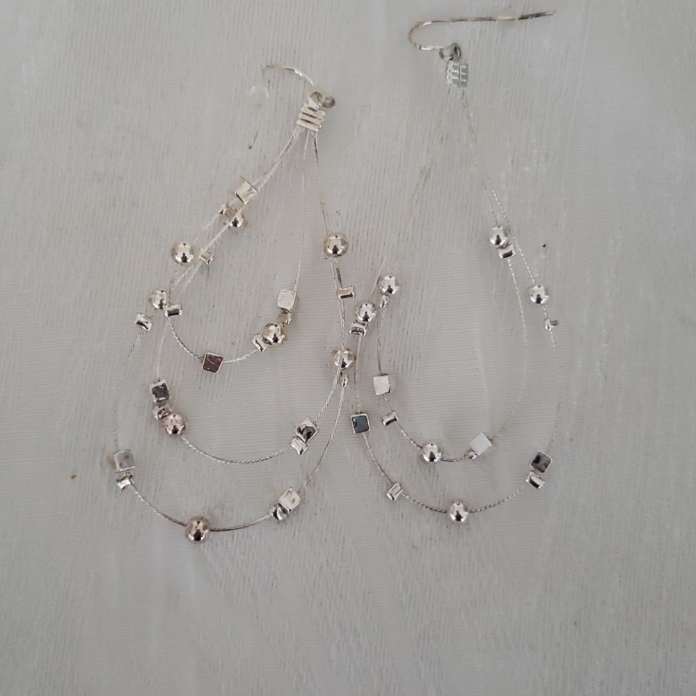 Silver tone hanging earrings